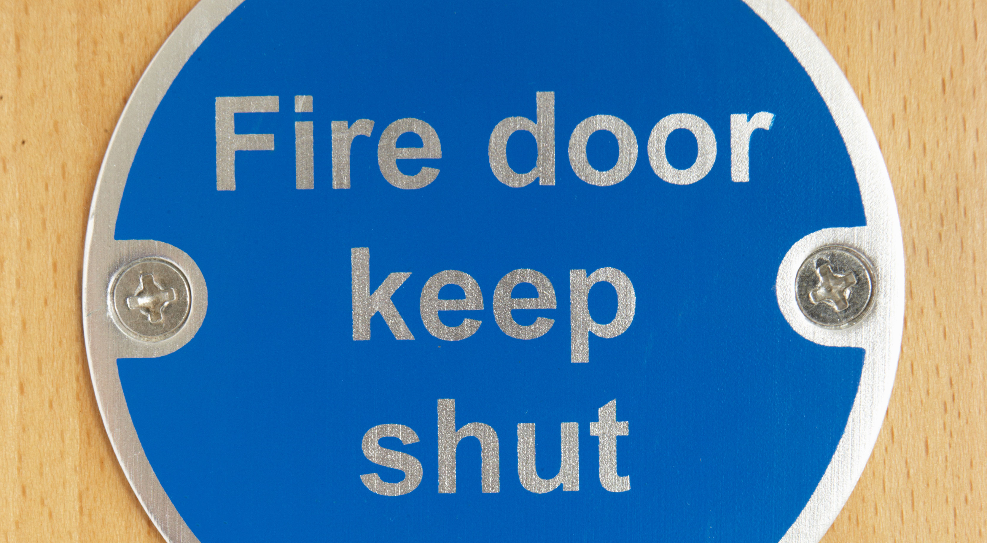 Fire doors with keep shut sign
