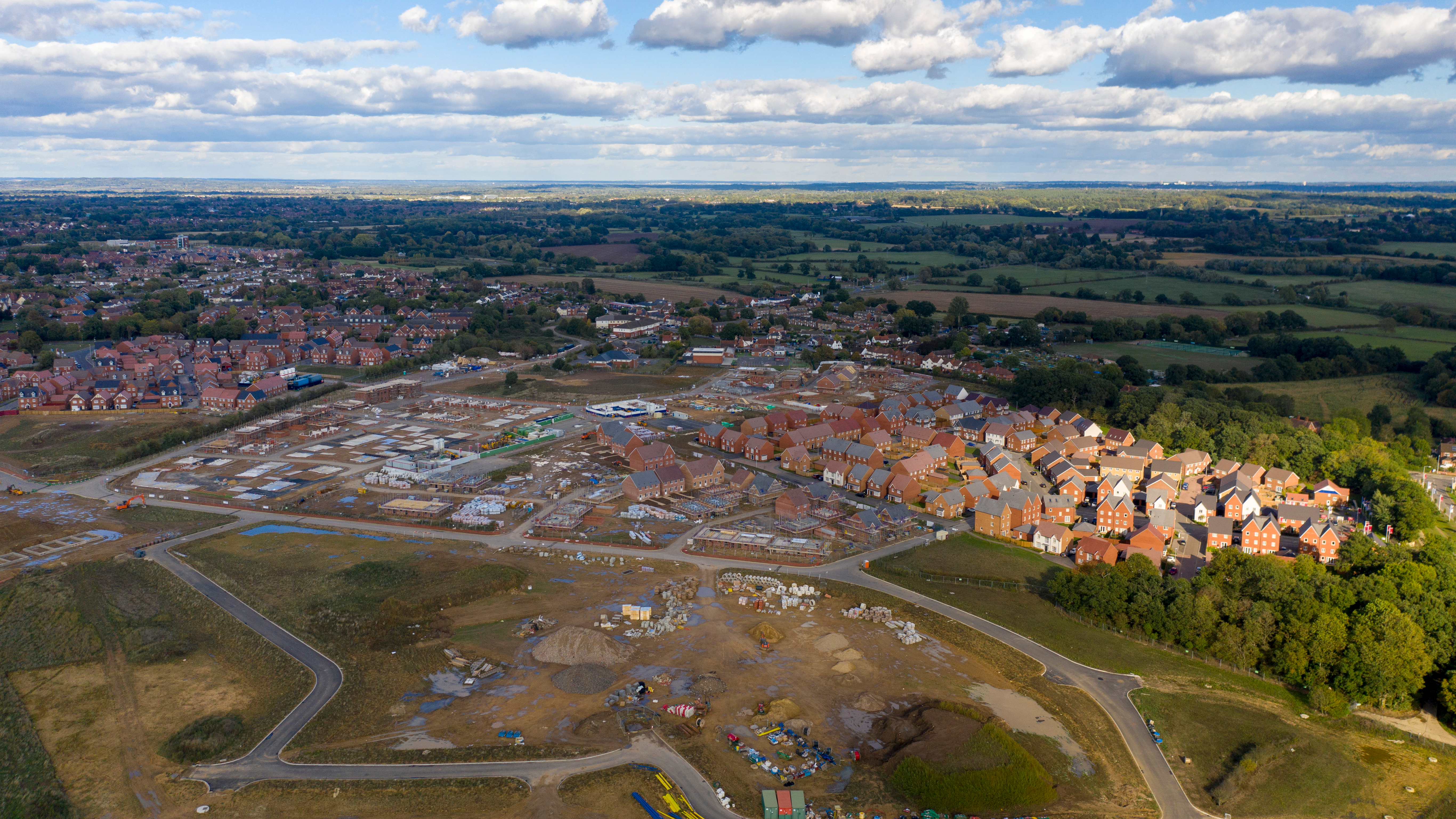 Aerial new housing estate construction on green belt land UK; Shutterstock ID 1199607199; purchase_order: -; job: -; client: -; other: -