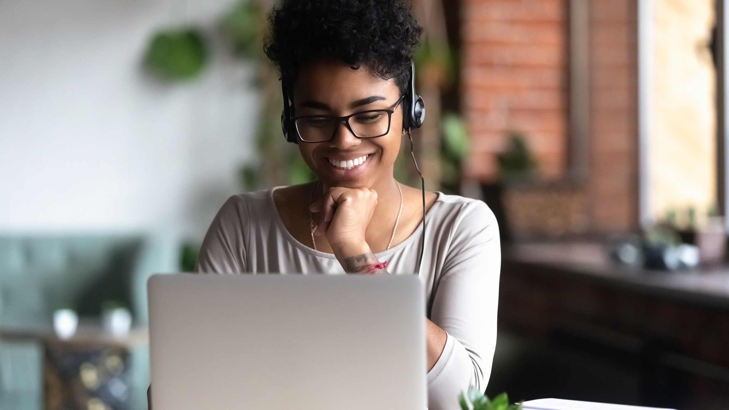 Woman sitting with laptop