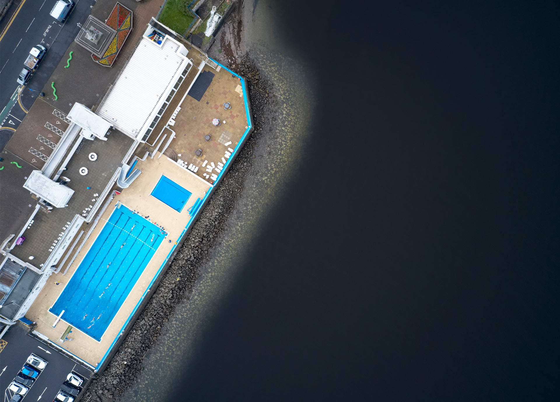 Gourock Outdoor Pool Aerial view of outdoor pool against a dark sea