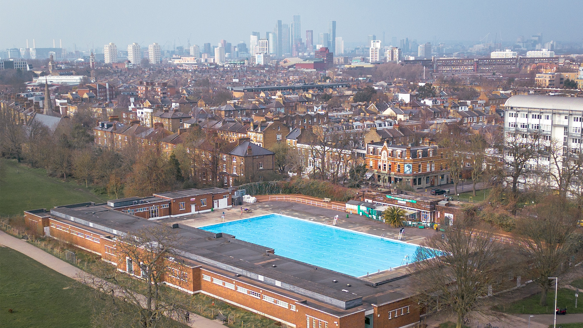 Brockwell lido Outdoor lido surrounded by buildings and London skyline