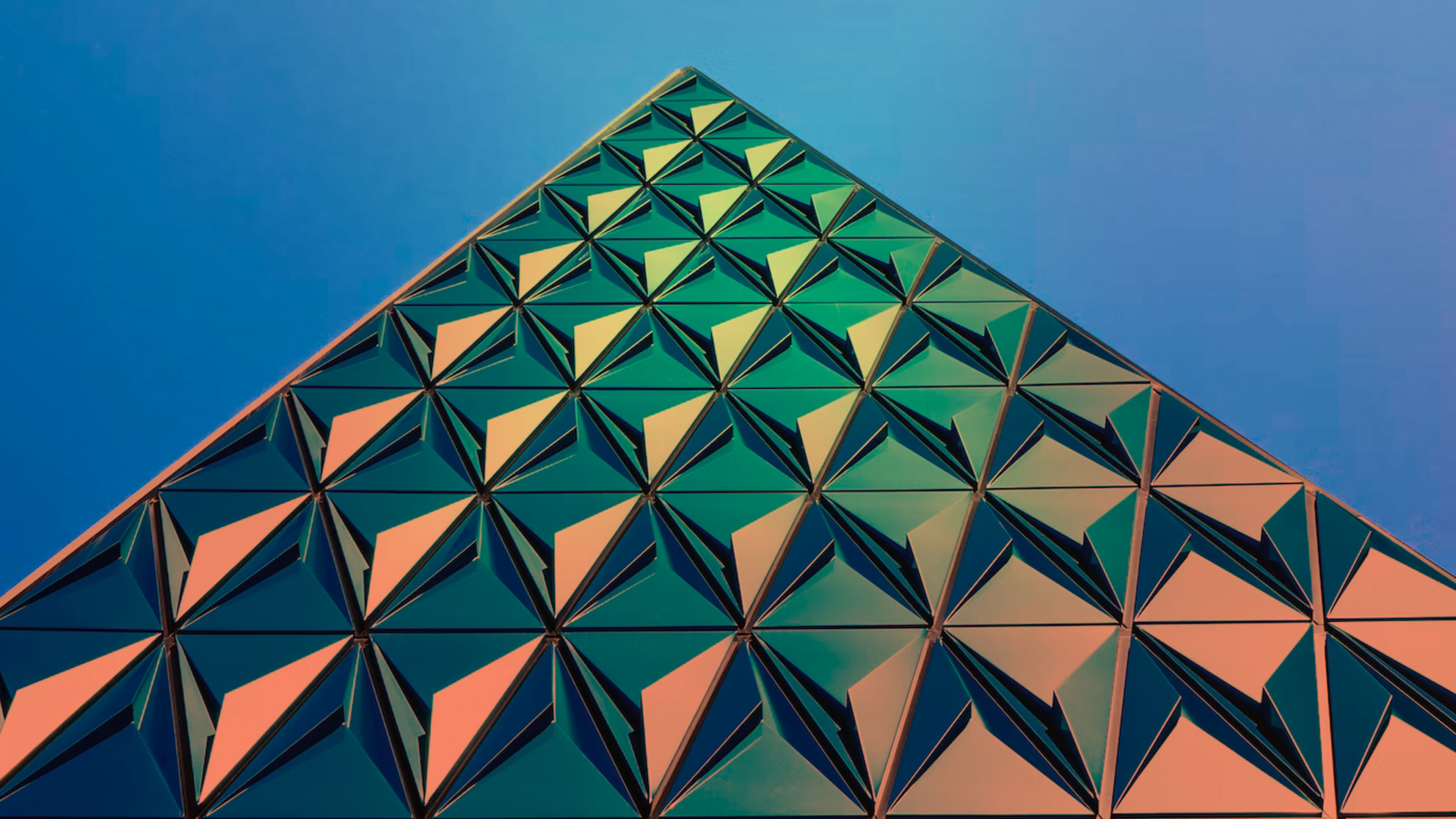 Photo of a triangular glass building