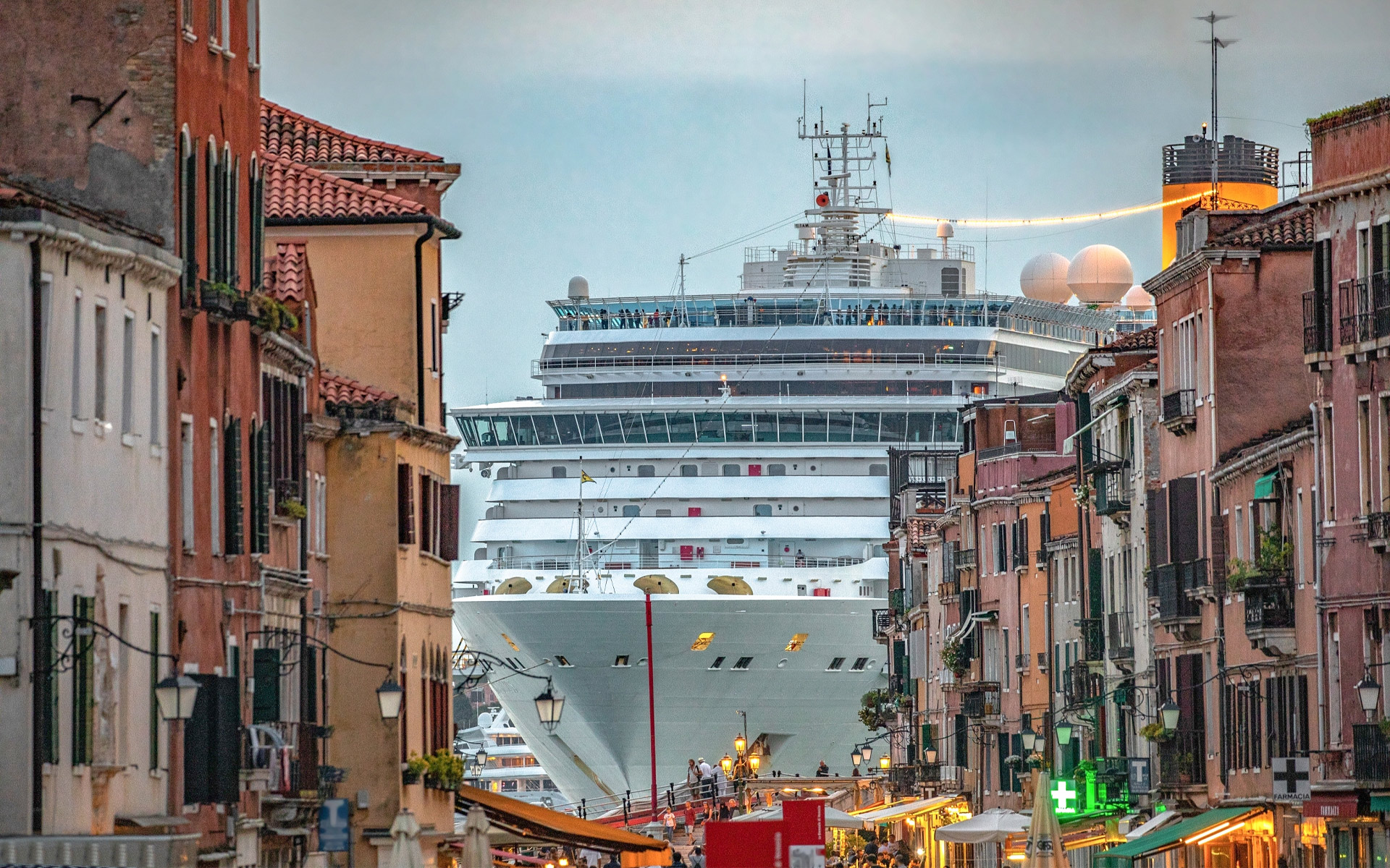 Photo of a cruise ship looming over Venice