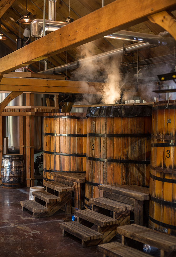 Whisky barrels inside wood distillery