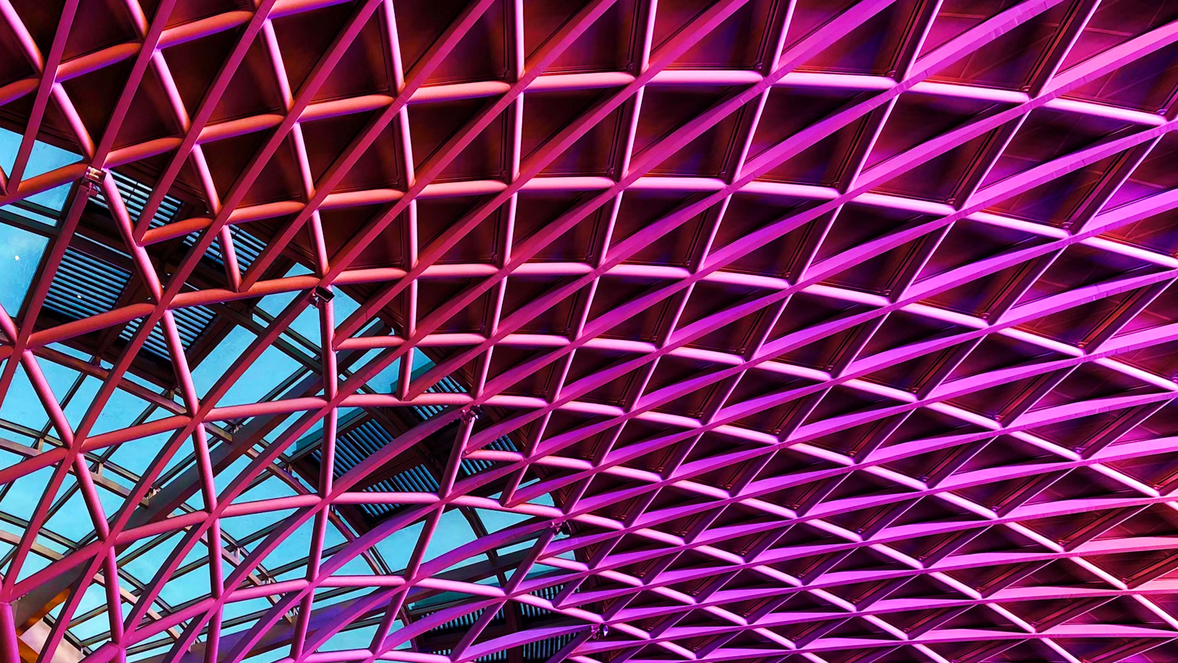 Ceiling of building lit up pink
