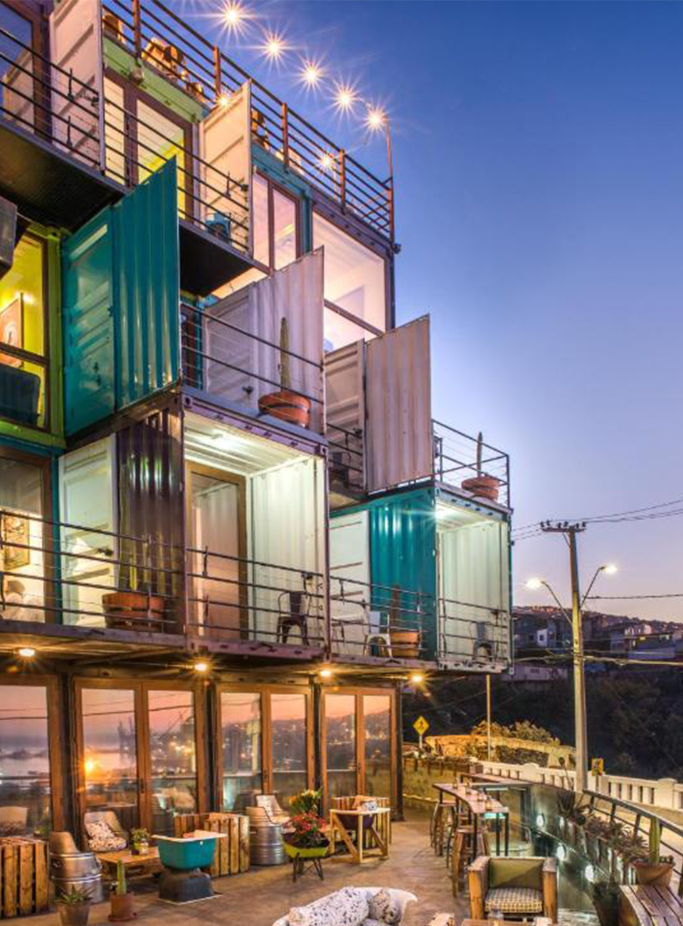 Colourful shipping containers stacked on top of each other converted into hotel rooms