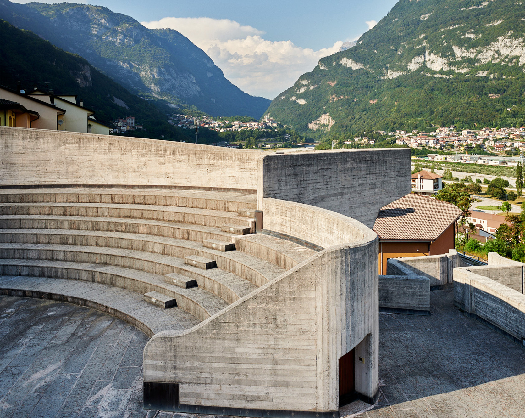 Chiesa della Beata Vergine Santa Maria Immacolata, Longarone Amphitheatre style concrete seating with mountain backdrop