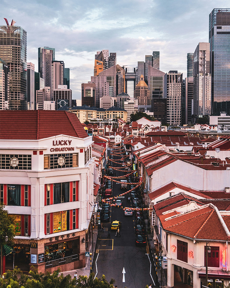 Chinatown, Singapore with modern skyscrapers behind Photo of Chinatown, Singapore with modern skyscrapers behind