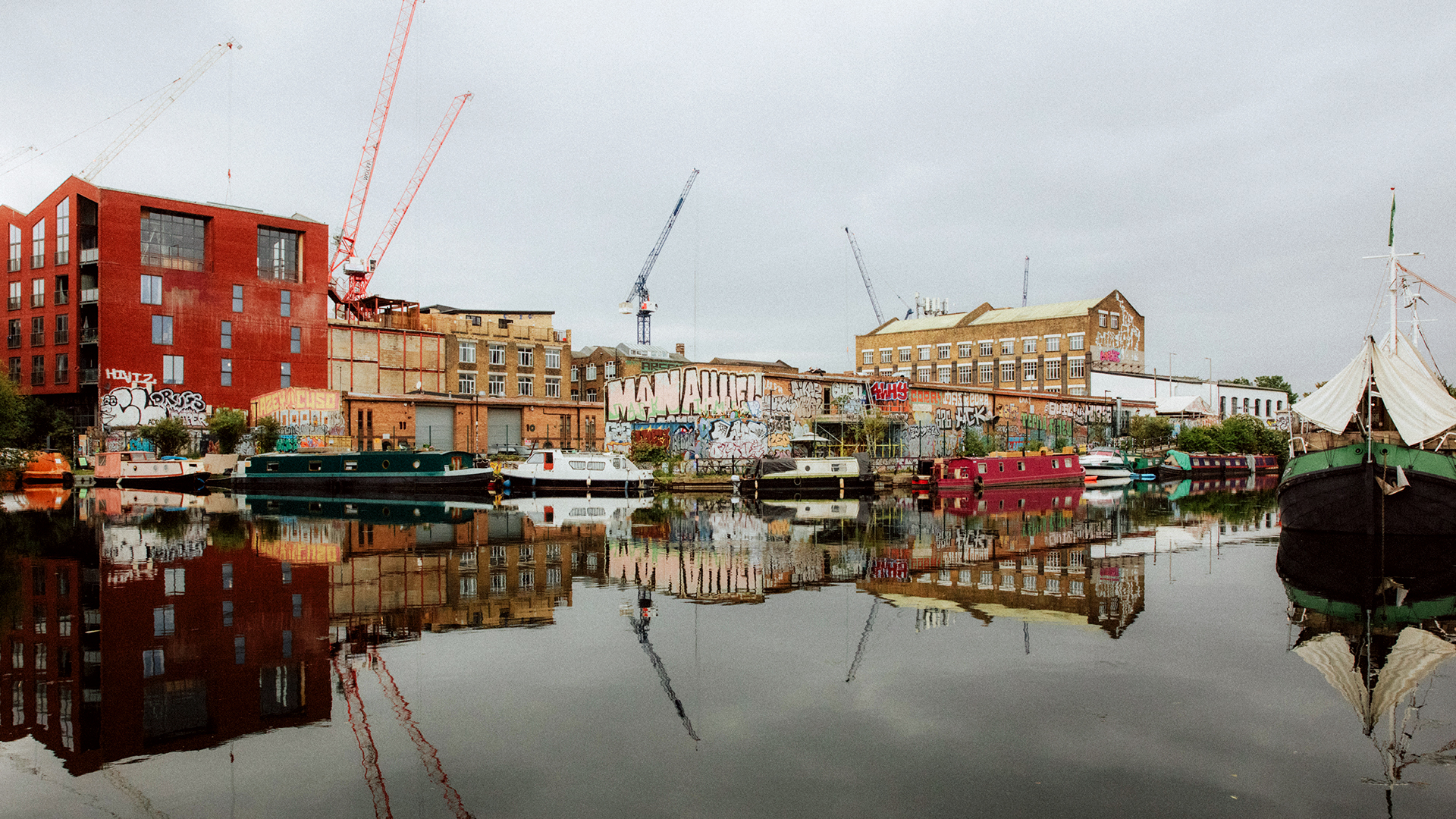 Hackney Wick skyline Cranes and graffitied warehouses over look the canal in Hackney Wick