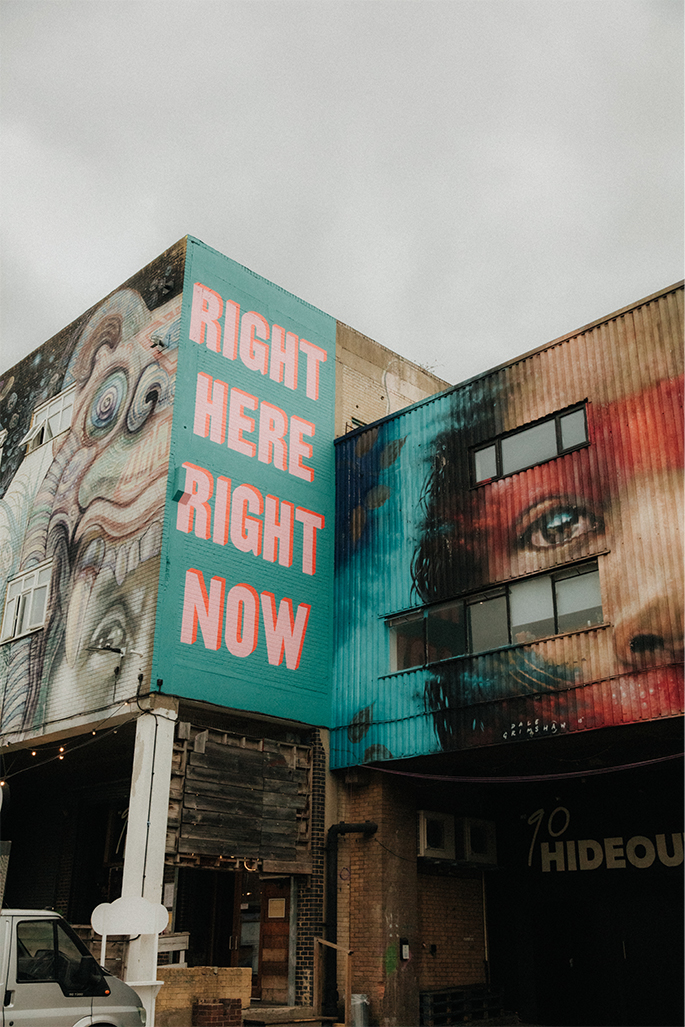 Hackney Wick venues Corrugated buildings with 'right here right now' painted on the side
