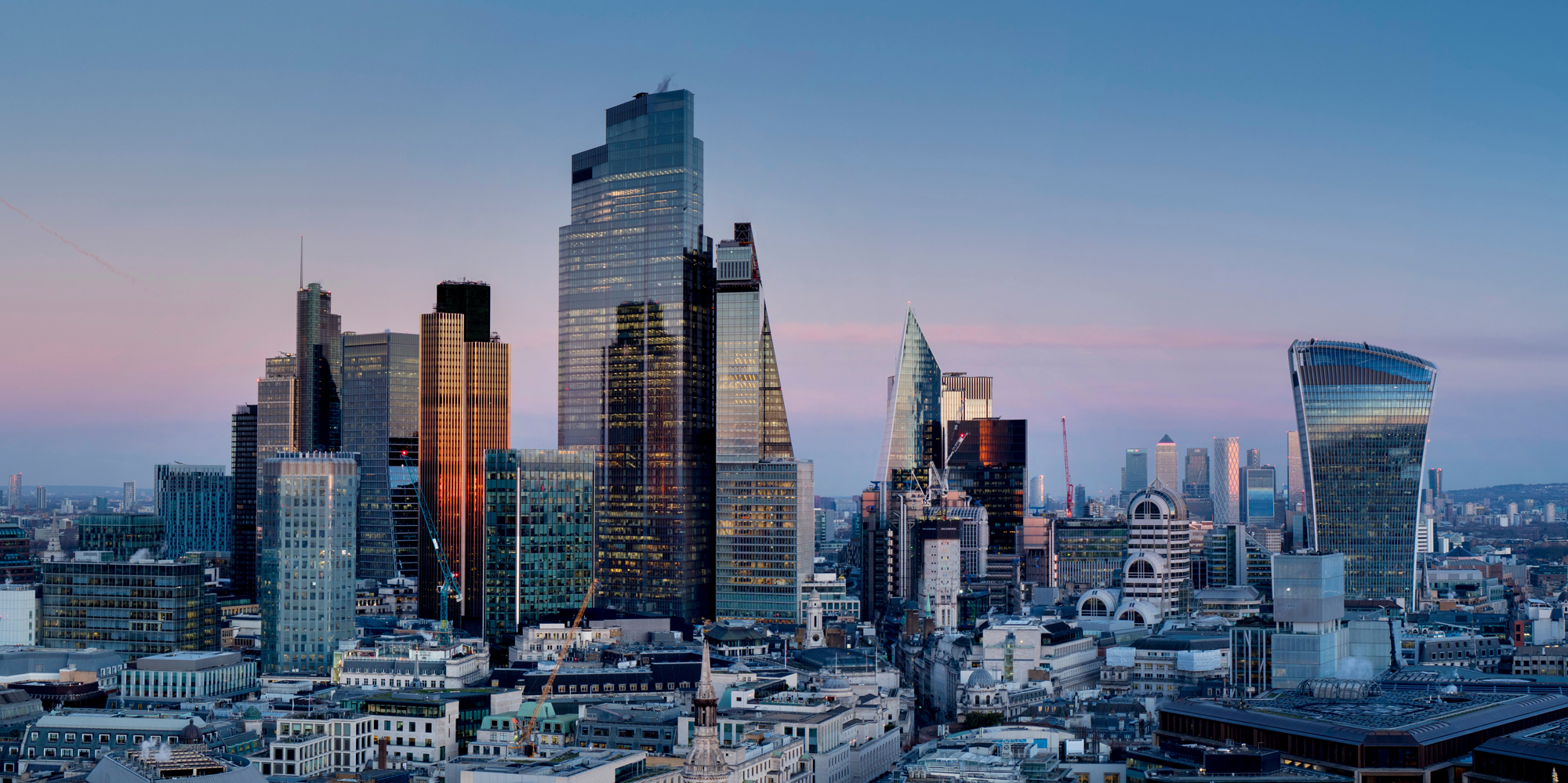 Photo of City of London skyline at sunset