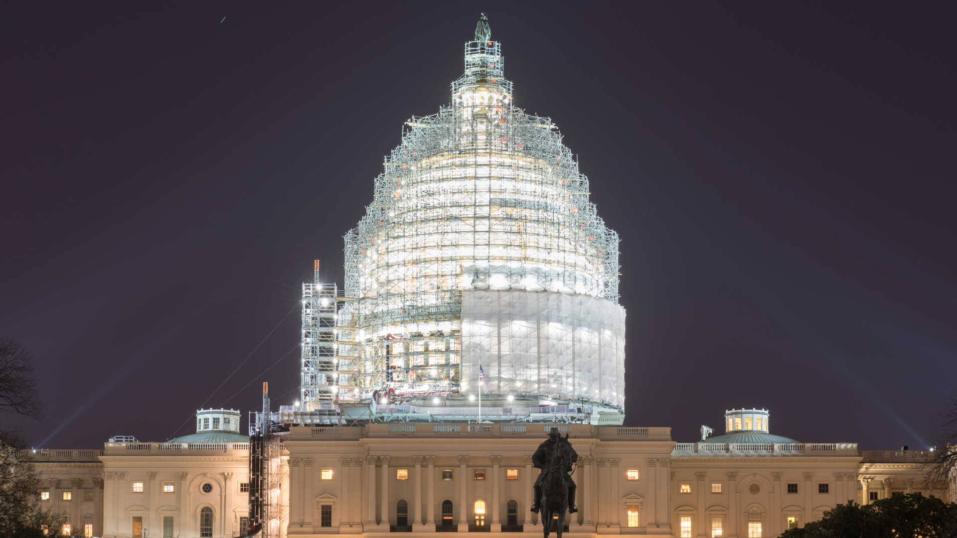 US Capitol building dome under renovation at night