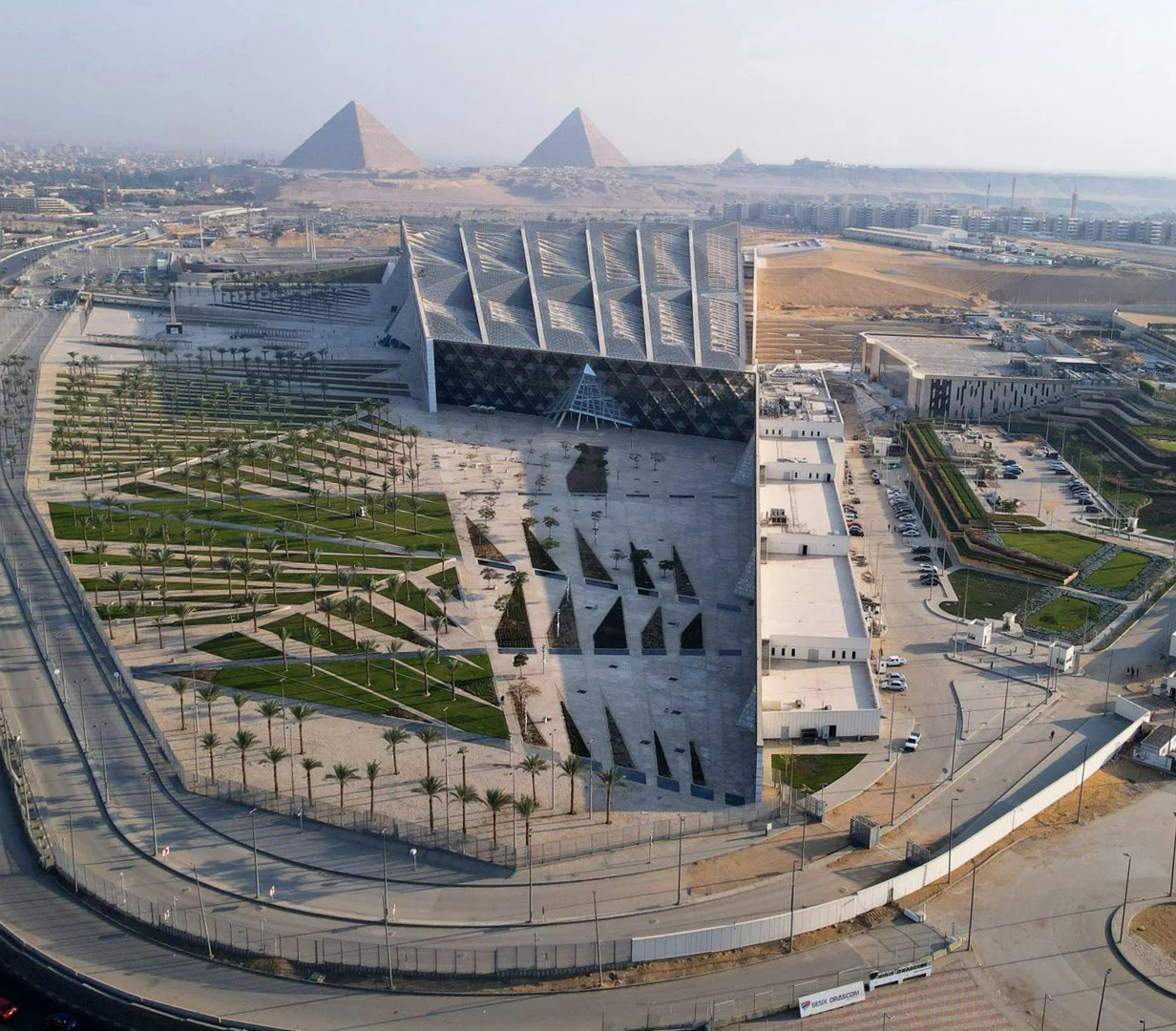 Aerial view of the Grand Egyptian Museum and the Pyramids of Giza Aerial view of the Grand Egyptian Museum and the Pyramids of Giza