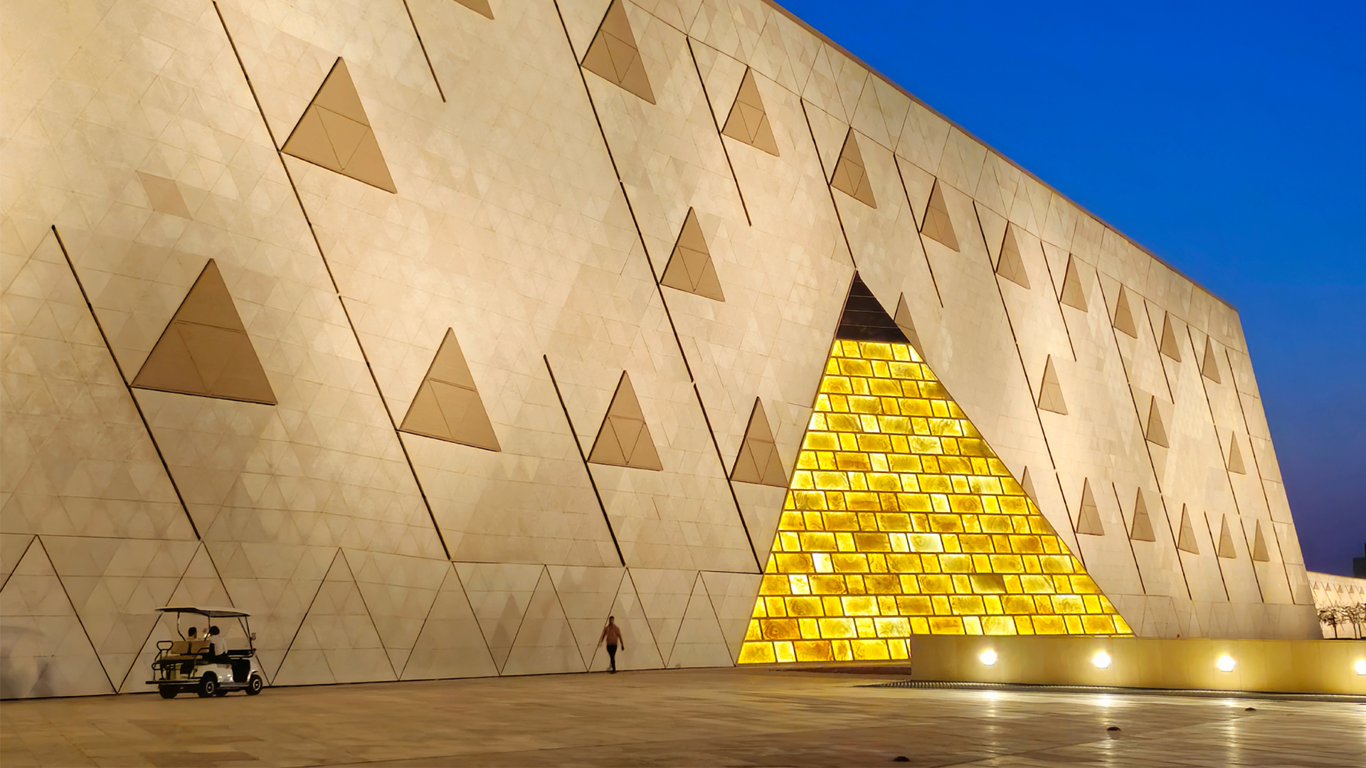 Grand Egyptian Museum entrance lit up Exterior of the Grand Egyptian Museum lit up at night