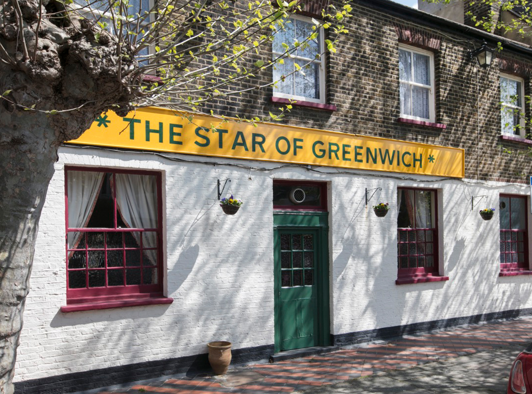 Pub exterior with sign saying star of greenwich