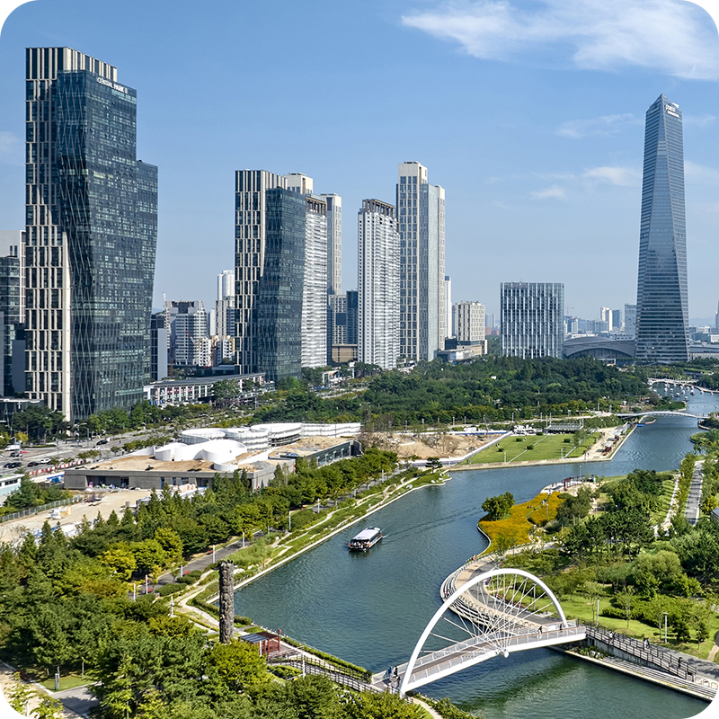 Skyscrapers alongside parks and rivers