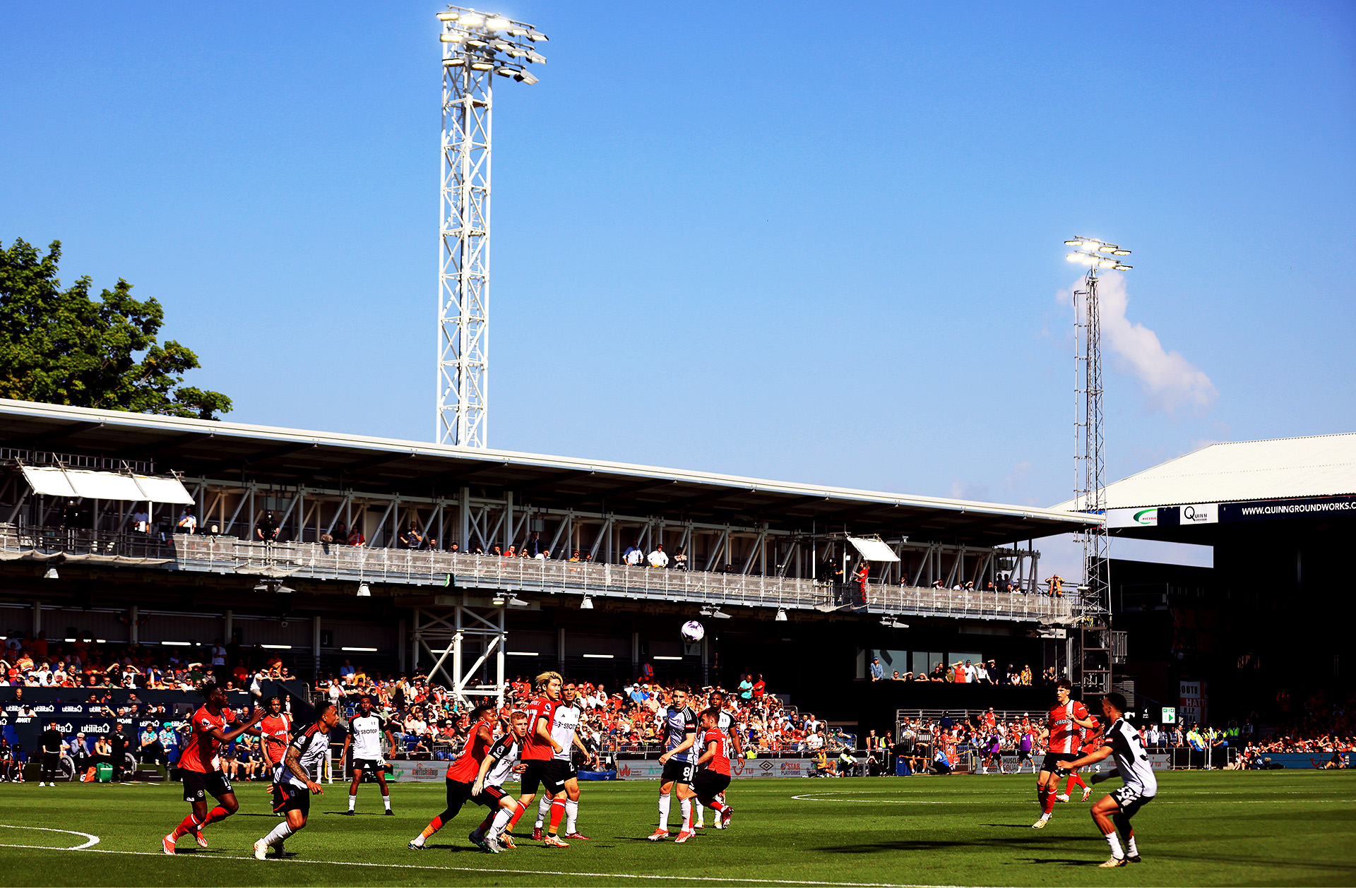 Football players on the pitch of Luton Town stadium