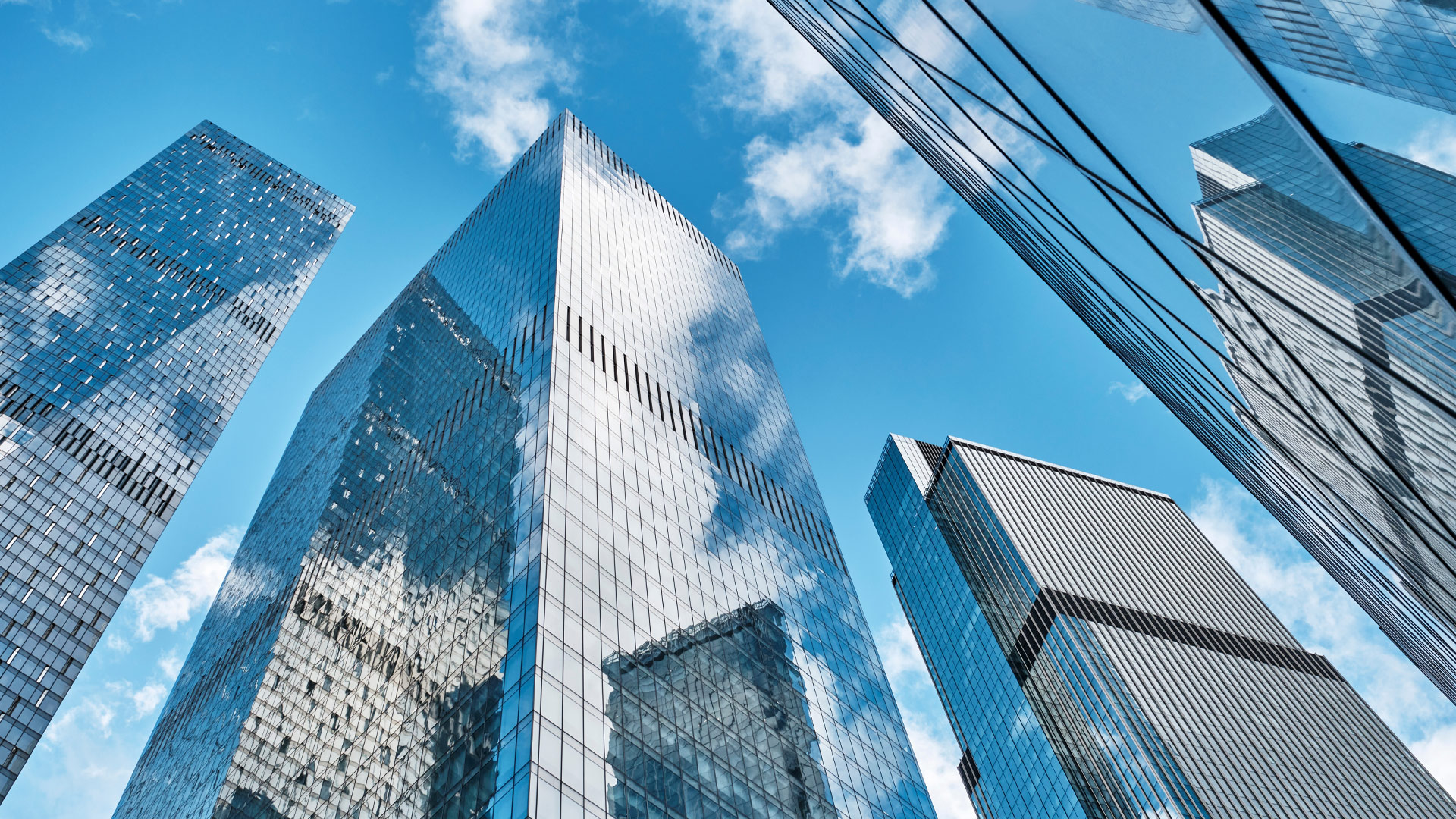Reflective buildings and a blue sky