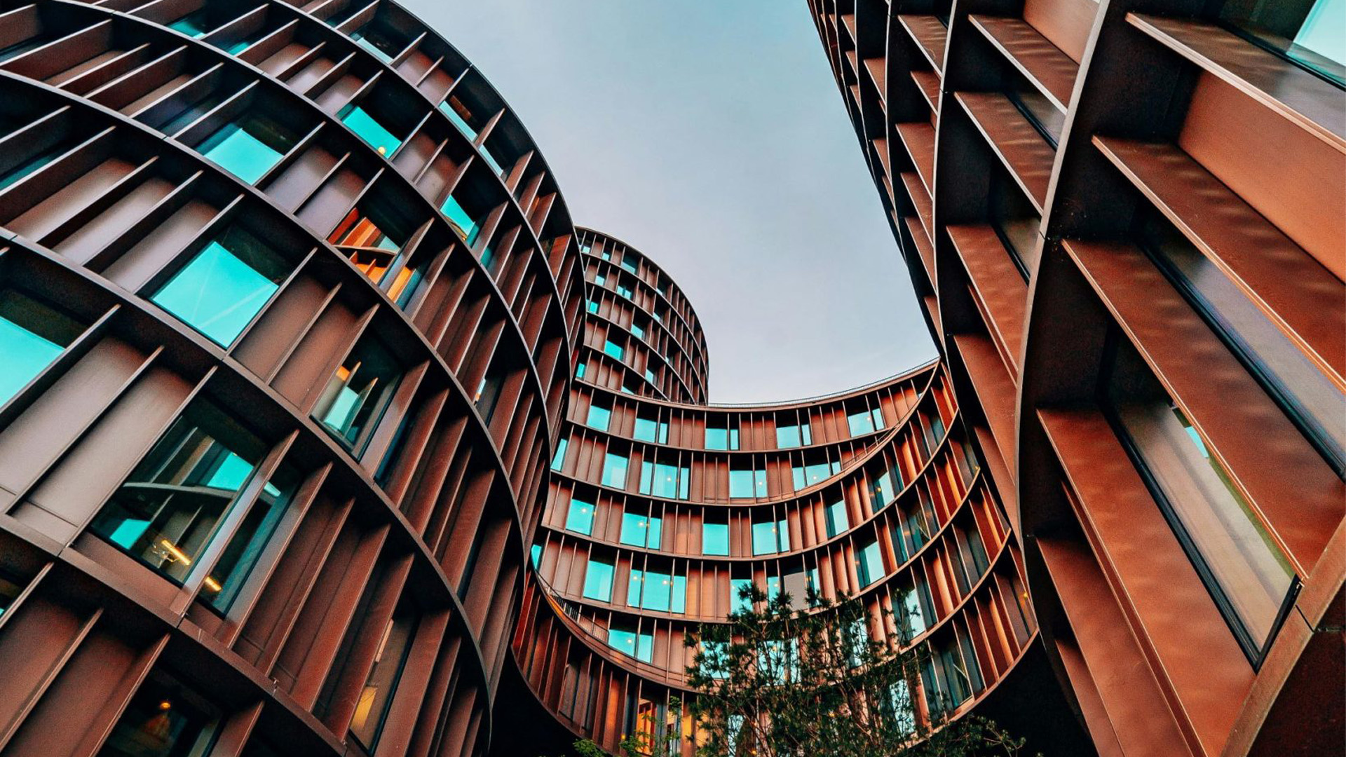 Looking up at copper colour buildings
