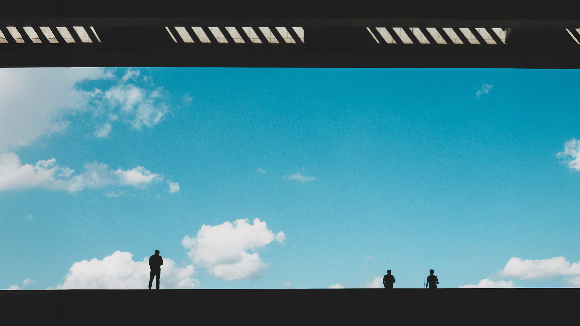 People with sky behind