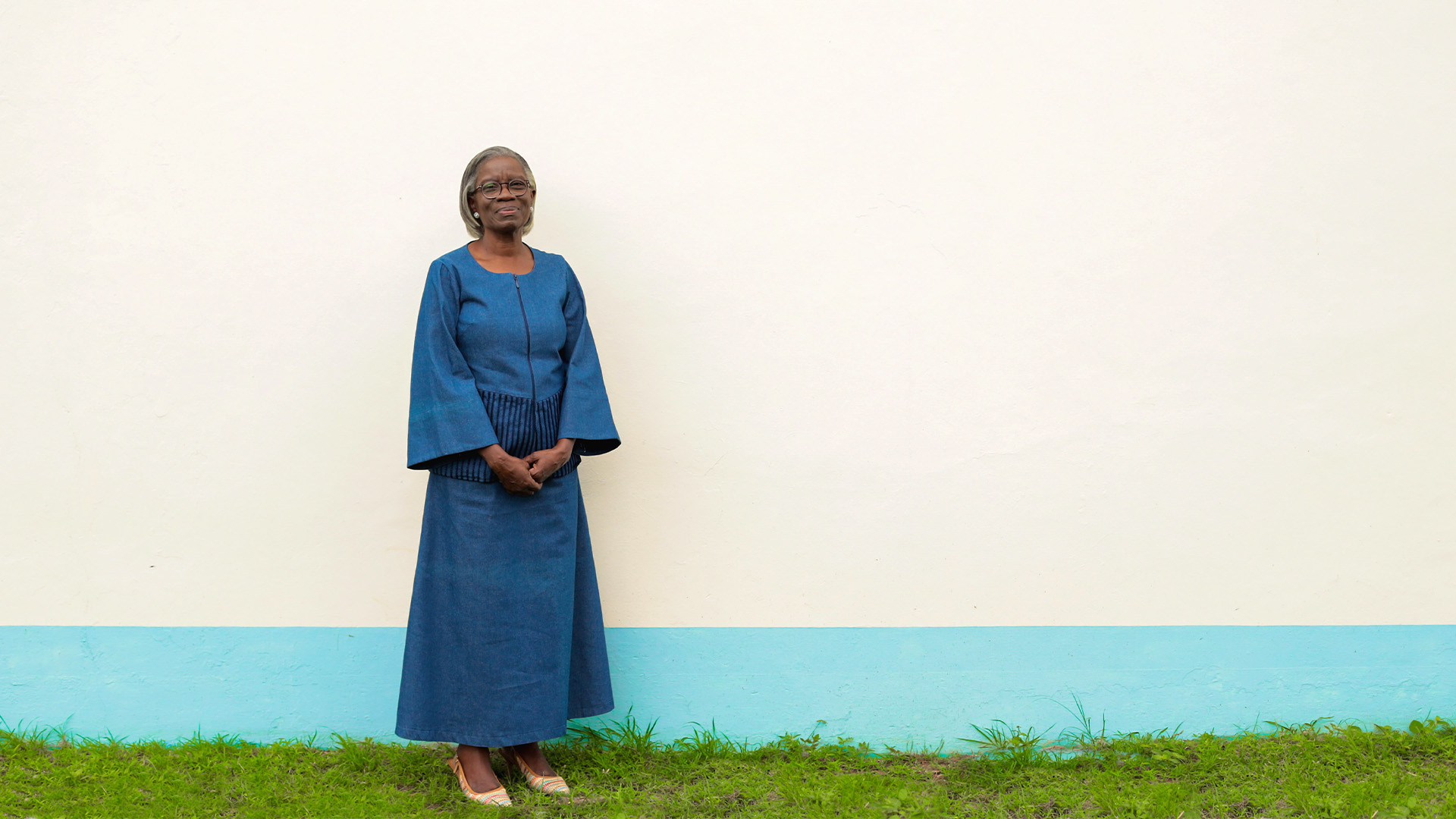Photo of Rosemargaret Esubonteng MRICS in front of a white wall
