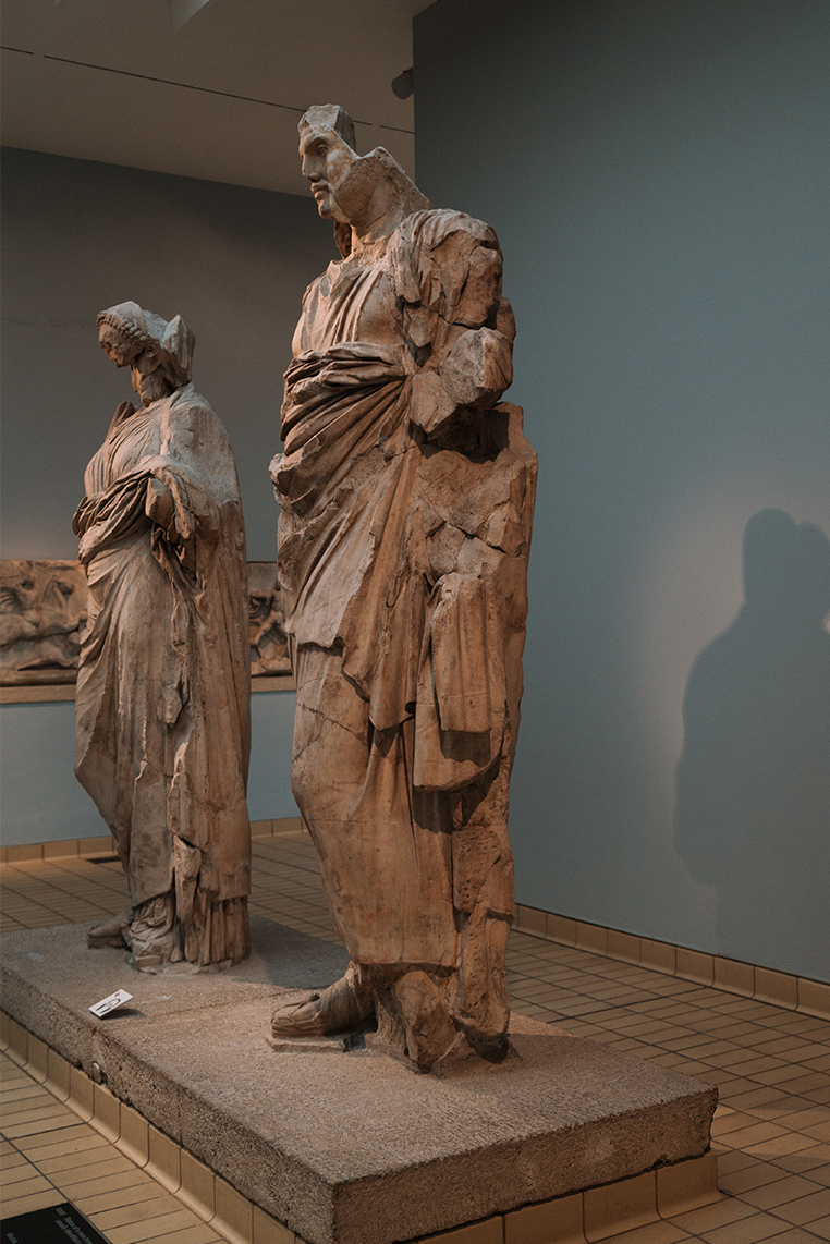 Greek sculptures casting shadows