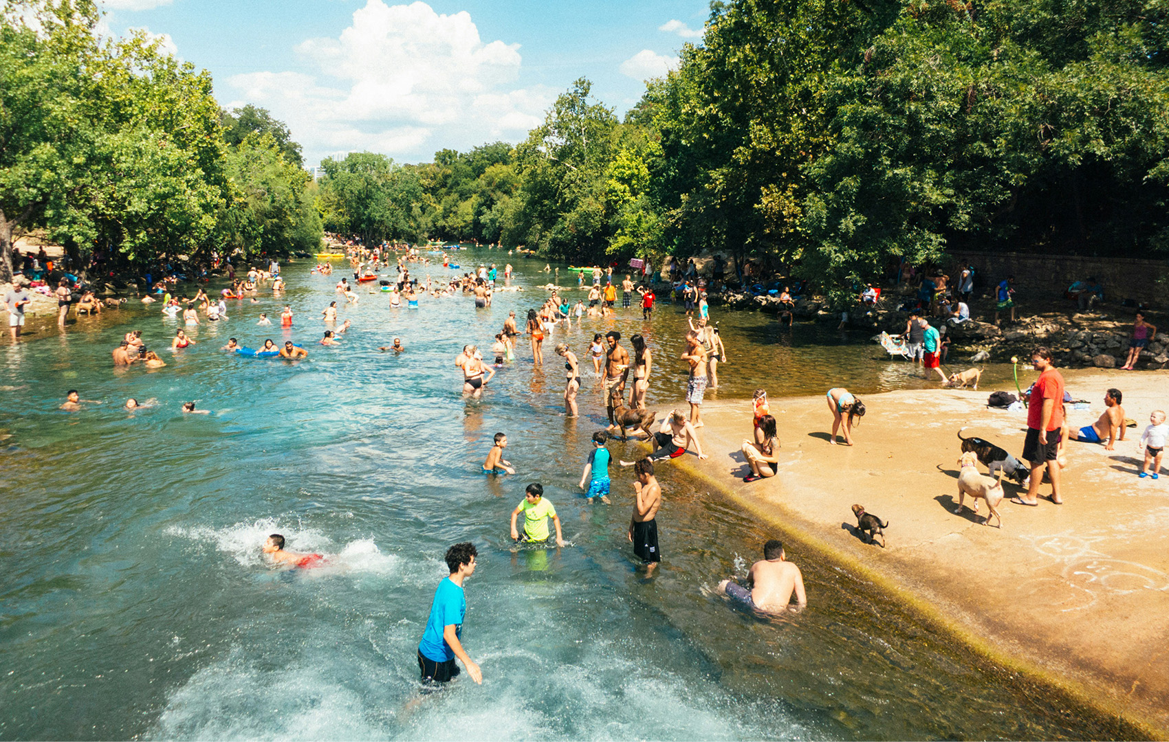 People swimming in spring water