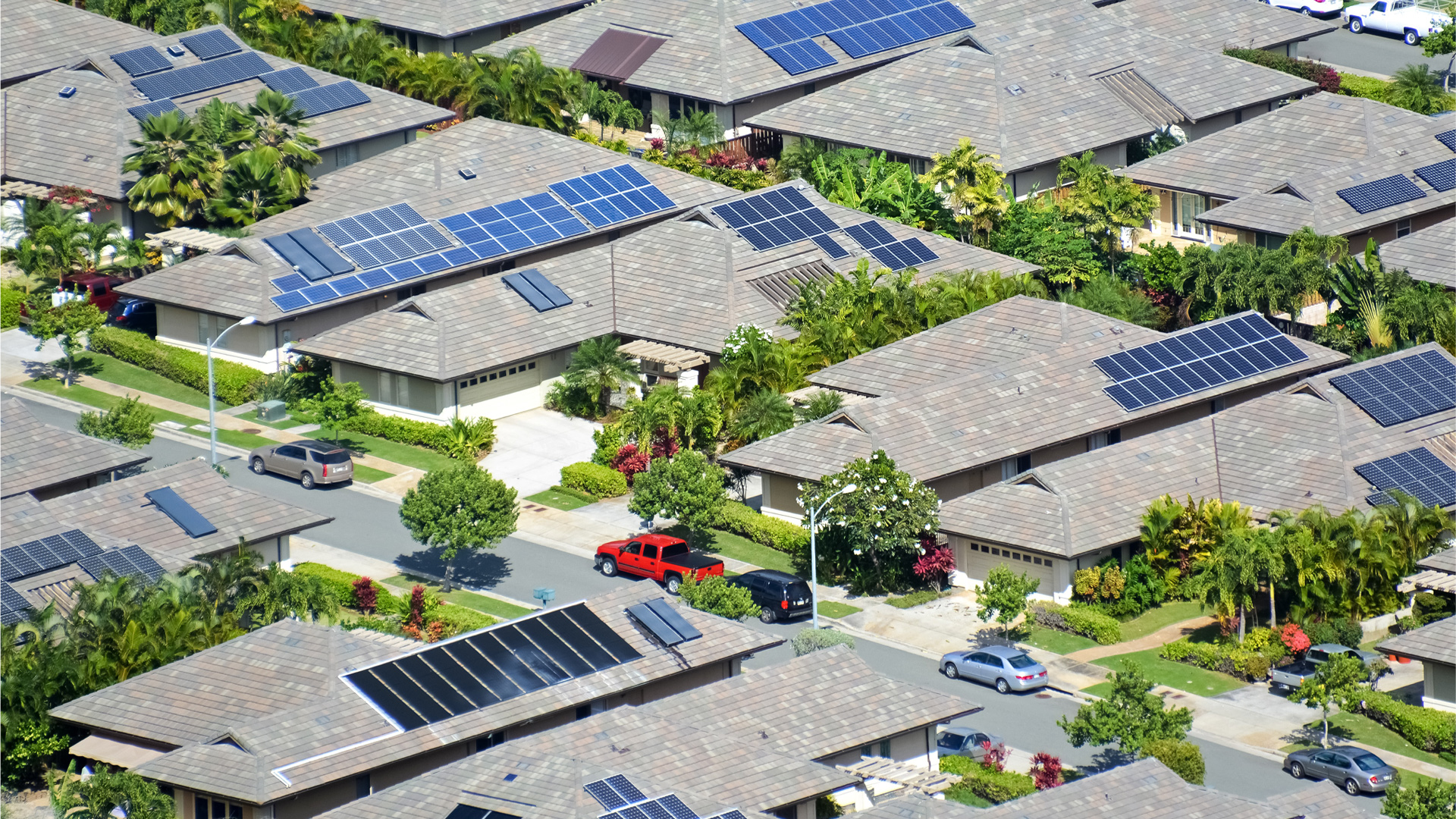 Aerial view of solar panels on roofs of houses