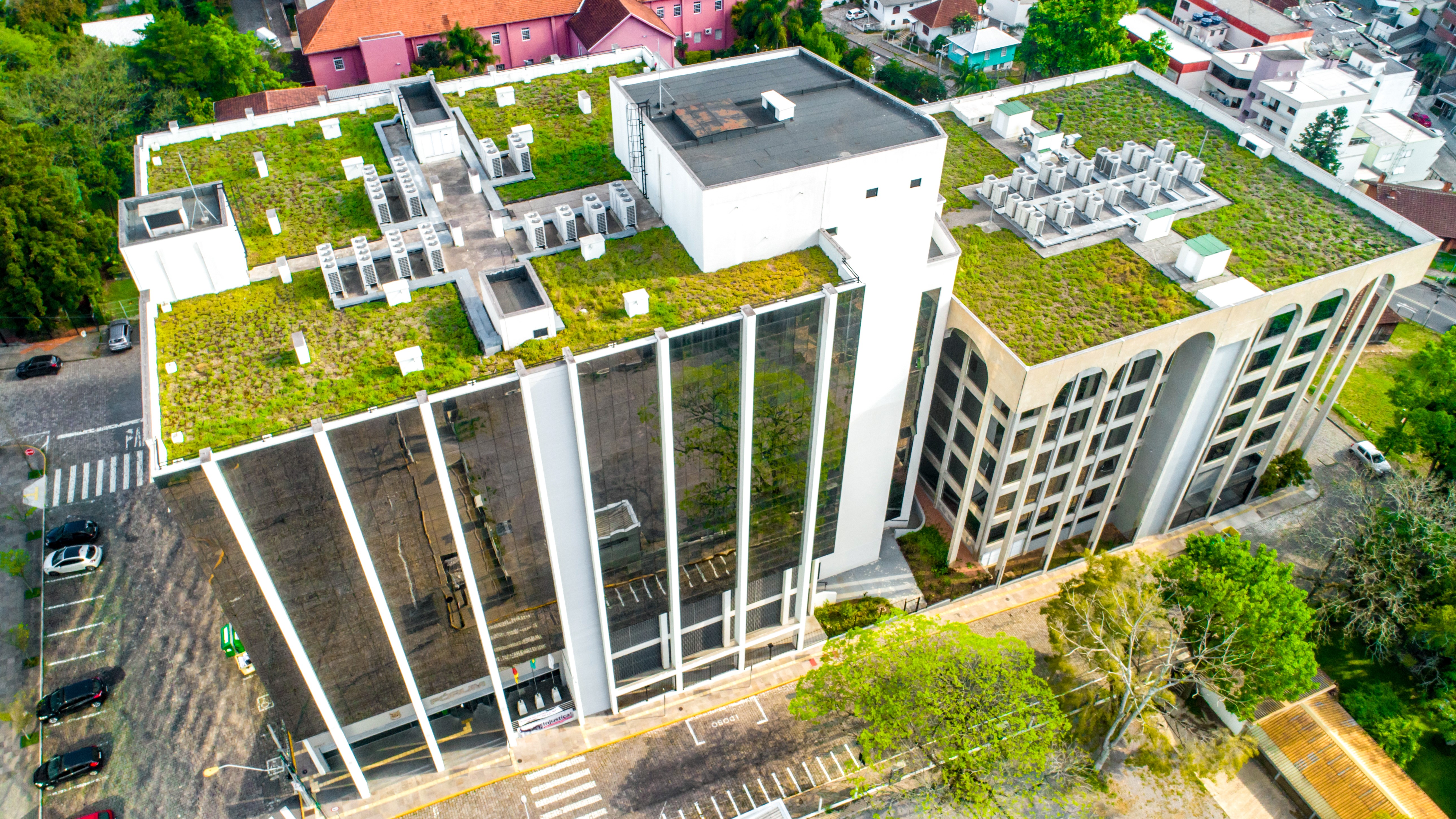Aerial view of high rise buildings with green roofs