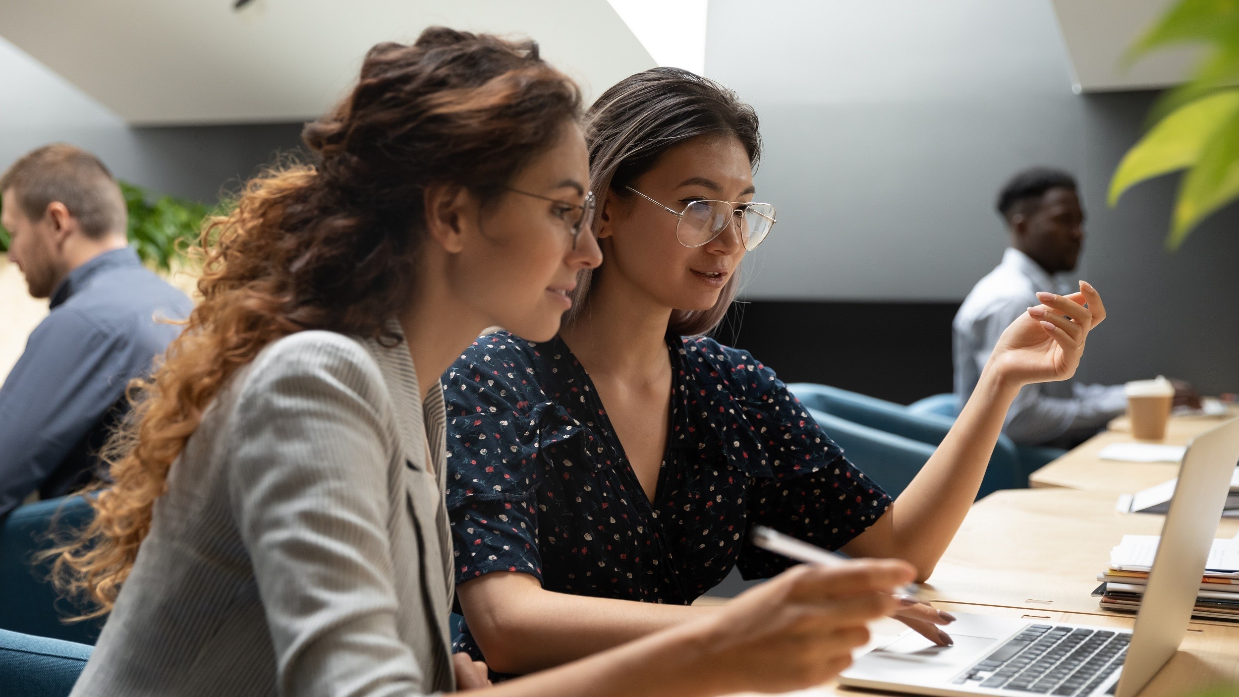 Woman with mentor working on laptop