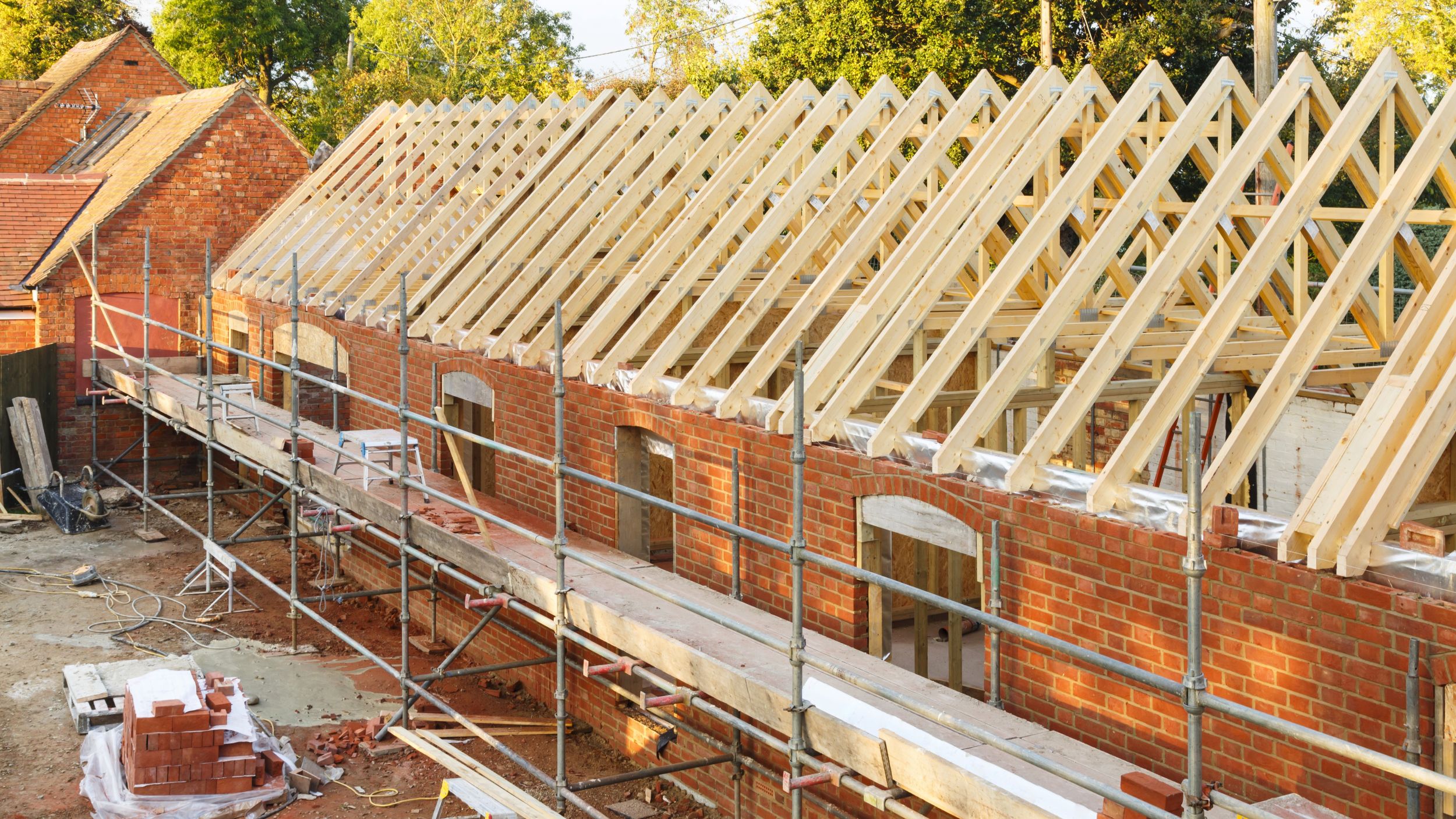 Overhead image of redbrick building in process of renovation