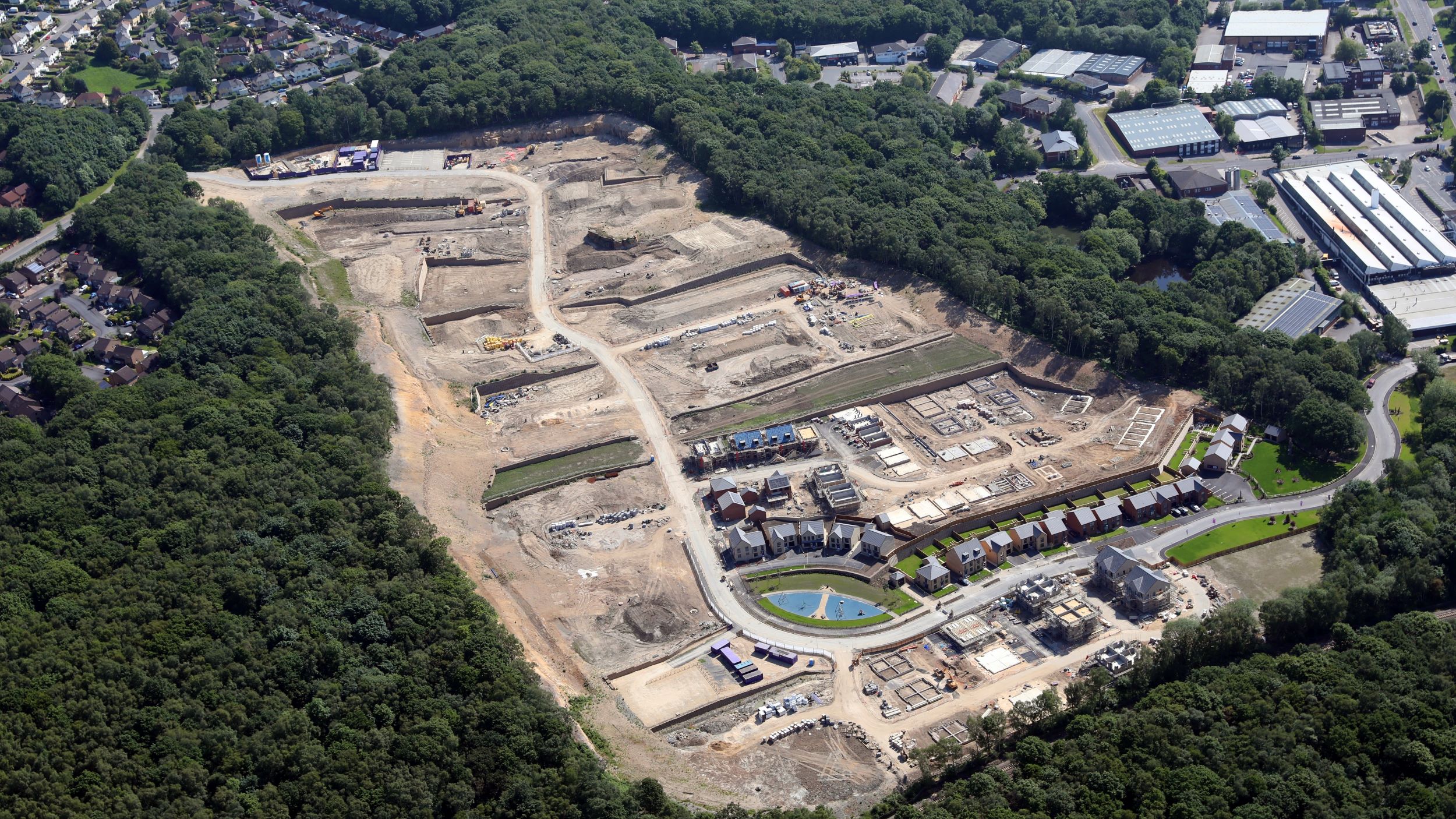 aerial view of a new housing estate being constructed in a disused quarry, UK