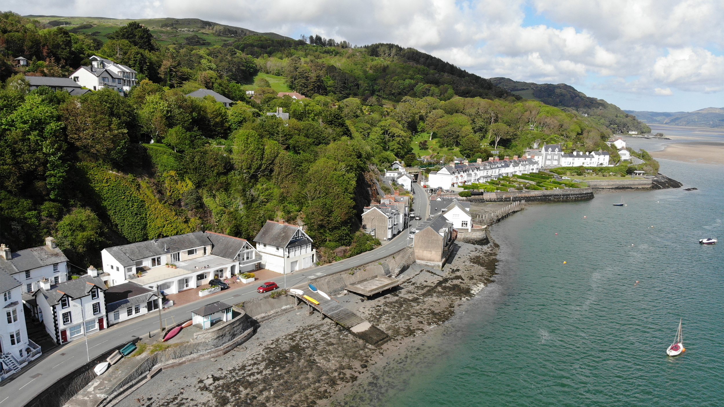 Aerial view of Aberdovey, Snowdonia, Wales in the sun, looking up the estuary