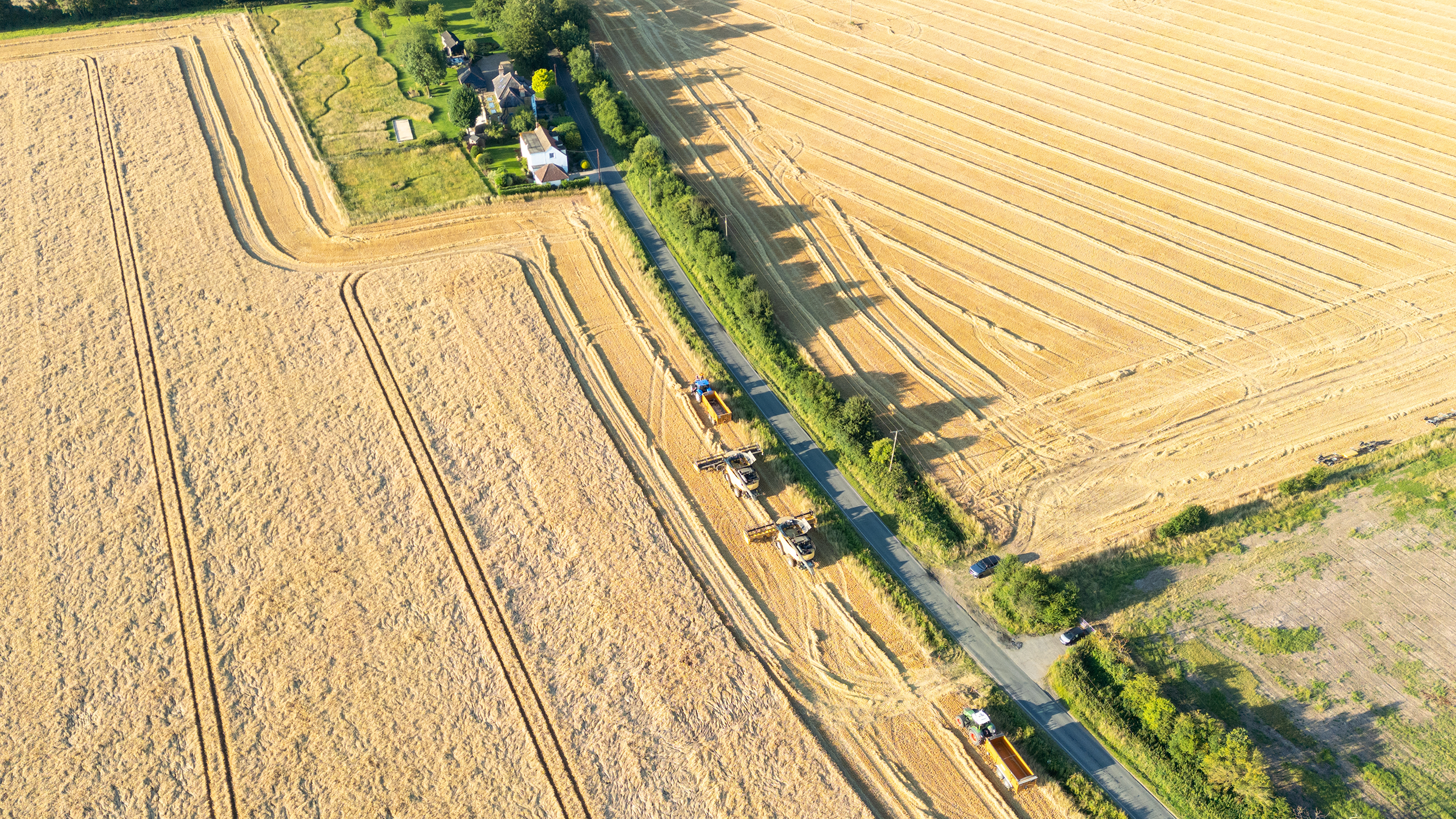 Combine harvesters and tractors on arable farm