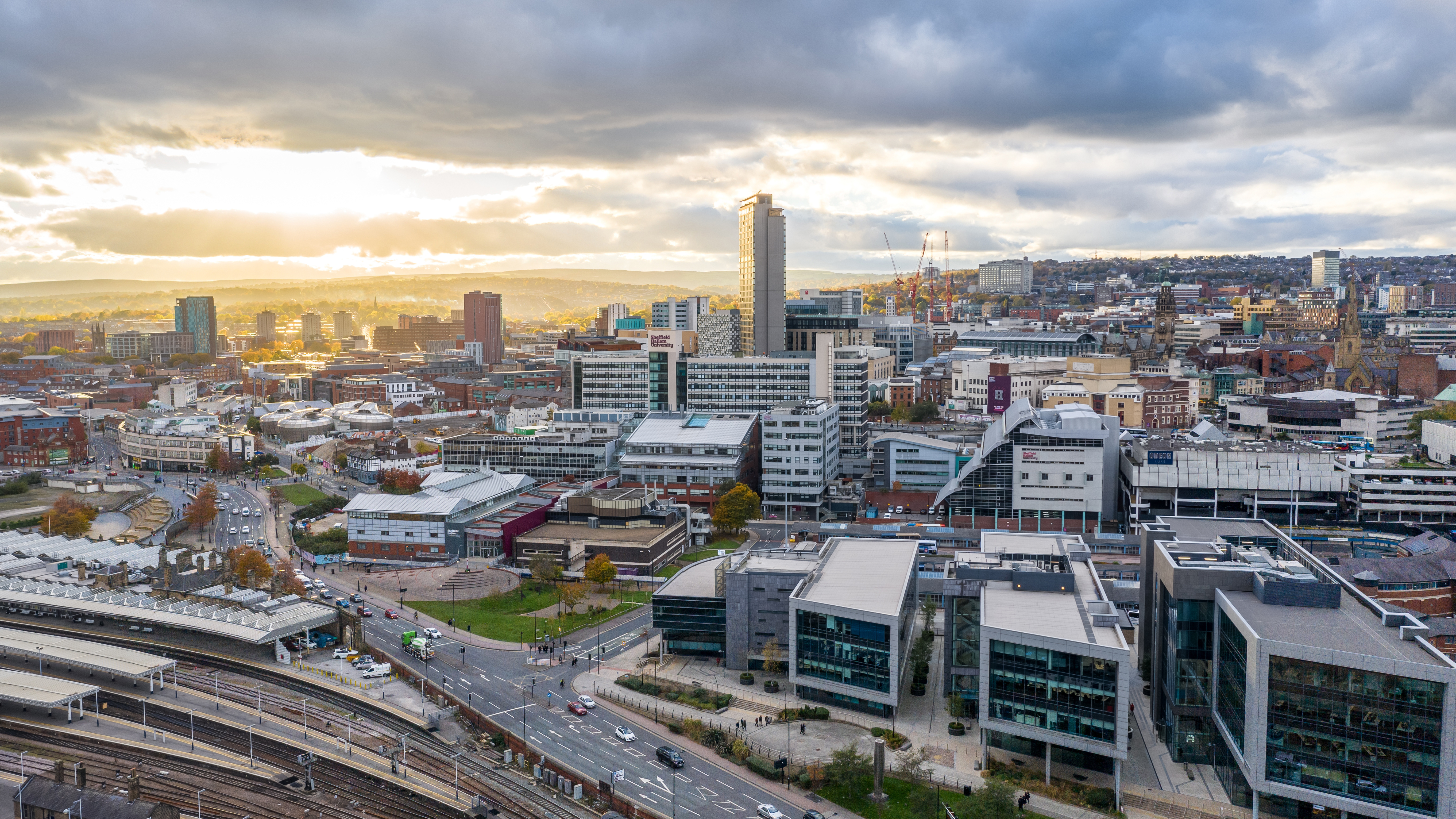 SHEFFIELD, UK - NOVEMBER 4, 2021.  An aerial panorama view of Sheffield city centre including the Electric Works and railway station at sunset; Shutterstock ID 2075300833; purchase_order: NA; job: RICS Property Journal Dec21; client: RICS; other: 