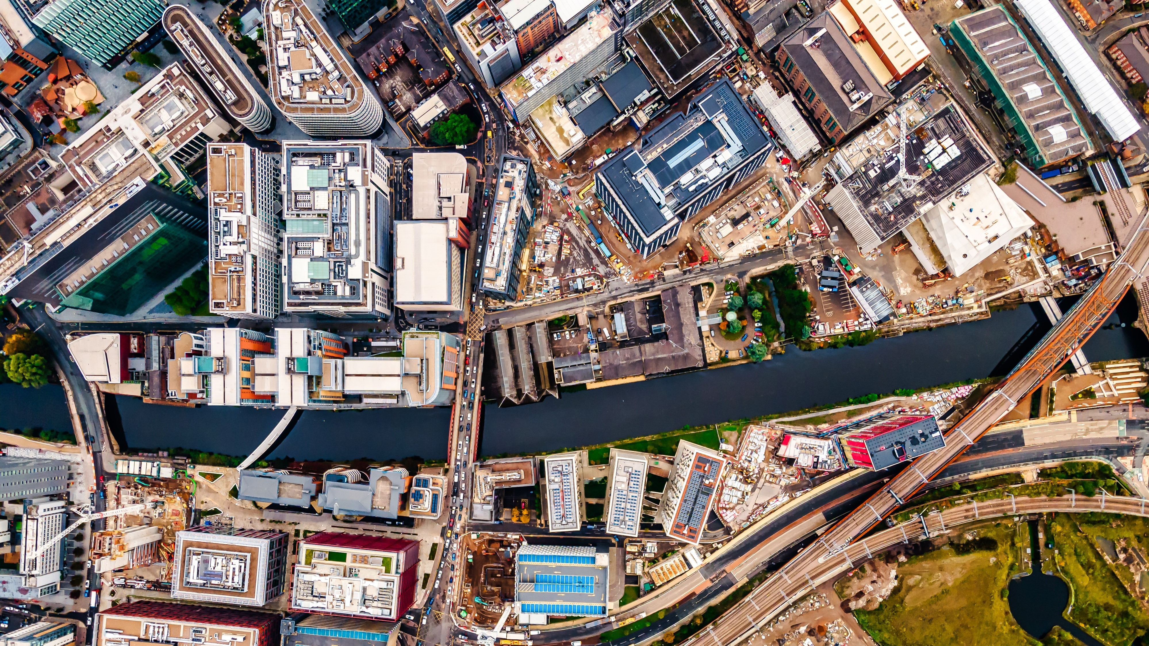 Aerial drone view of Manchester city in UK on a beautiful sunny day.; Shutterstock ID 2133419901; purchase_order: N/A; job: PJ Jane Dockery 2022; client: ; other: 