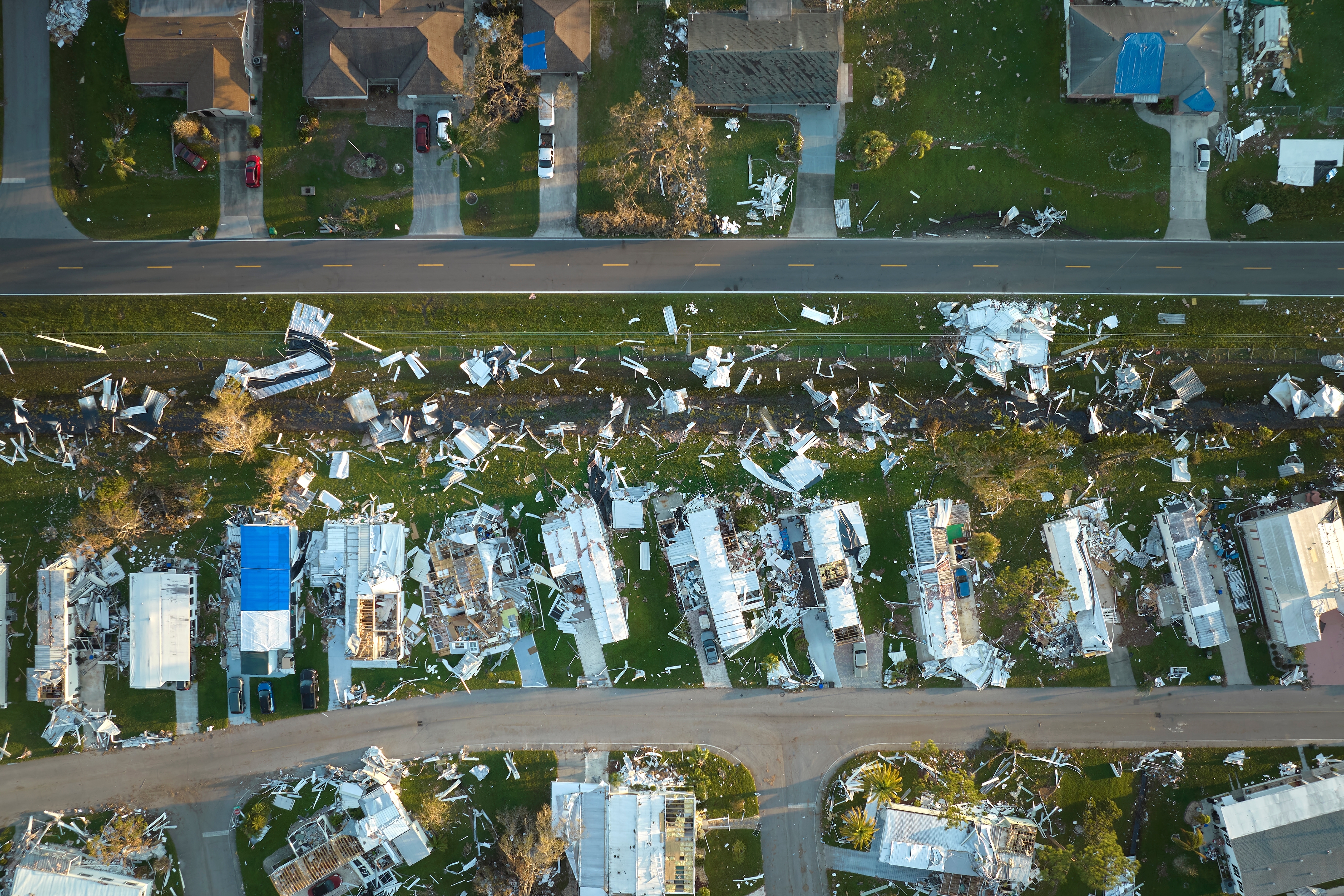 Hurricane Ian destroyed homes in Florida residential area. Natural disaster and its consequences; Shutterstock ID 2210965957; purchase_order: n/a; job: Keith Petrie; client: ; other: 