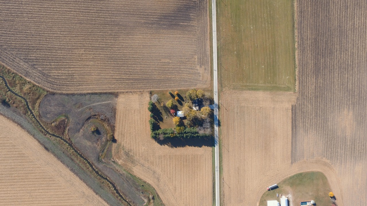 A farmhouse surrounded by fields - shown top down
